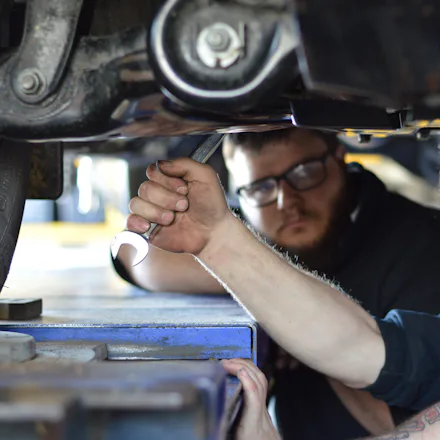 Mechanics in Naracoorte Trident Tyre Centre working on car